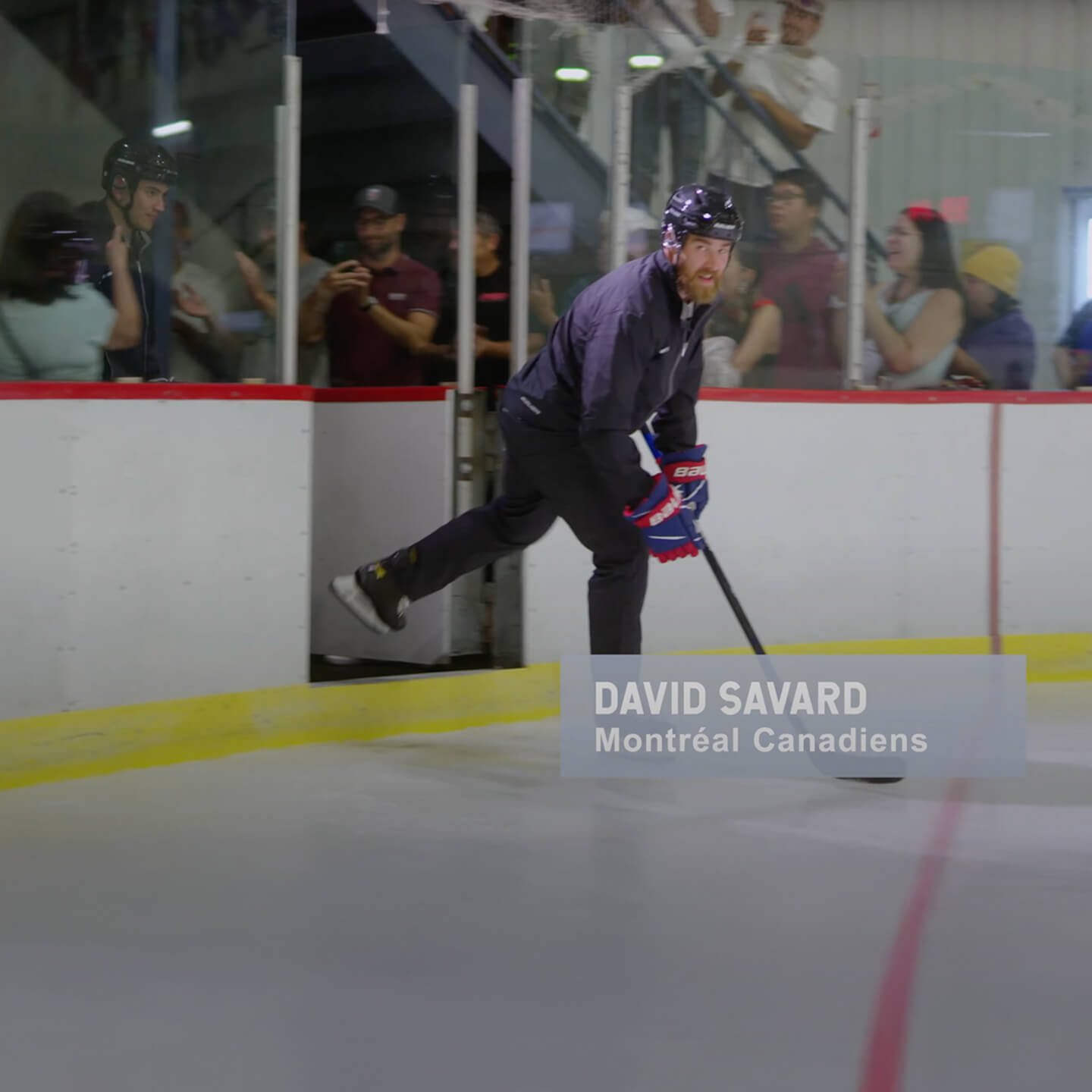David Savard of the Montreal Canadiens skates from the players’ bench onto the ice with his hockey stick in hand.