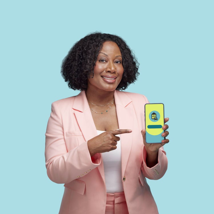 Person smiling and pointing to their phone screen displaying a quote.