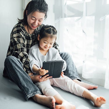 Mother and daughter reading Sonnet newsletter