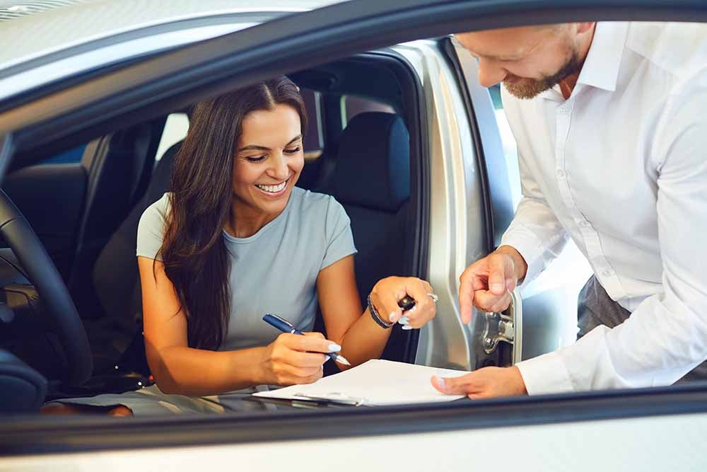 Woman renting a car