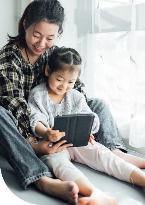 Mother and daughter reading Sonnet newsletter