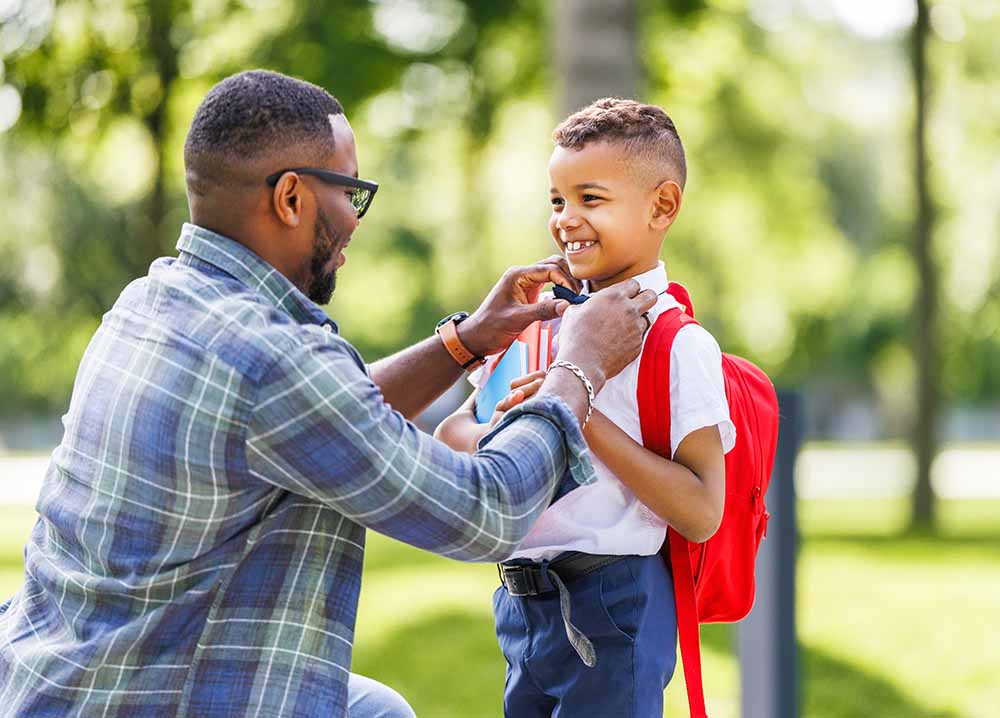 Father with his young son at school