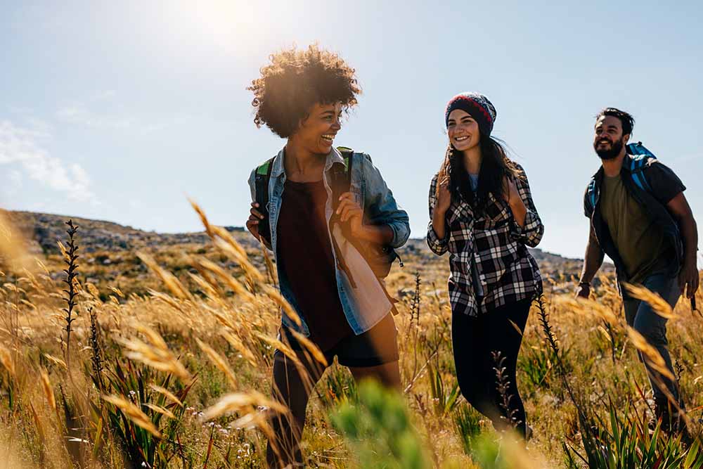 People outdoors on a hiking trail