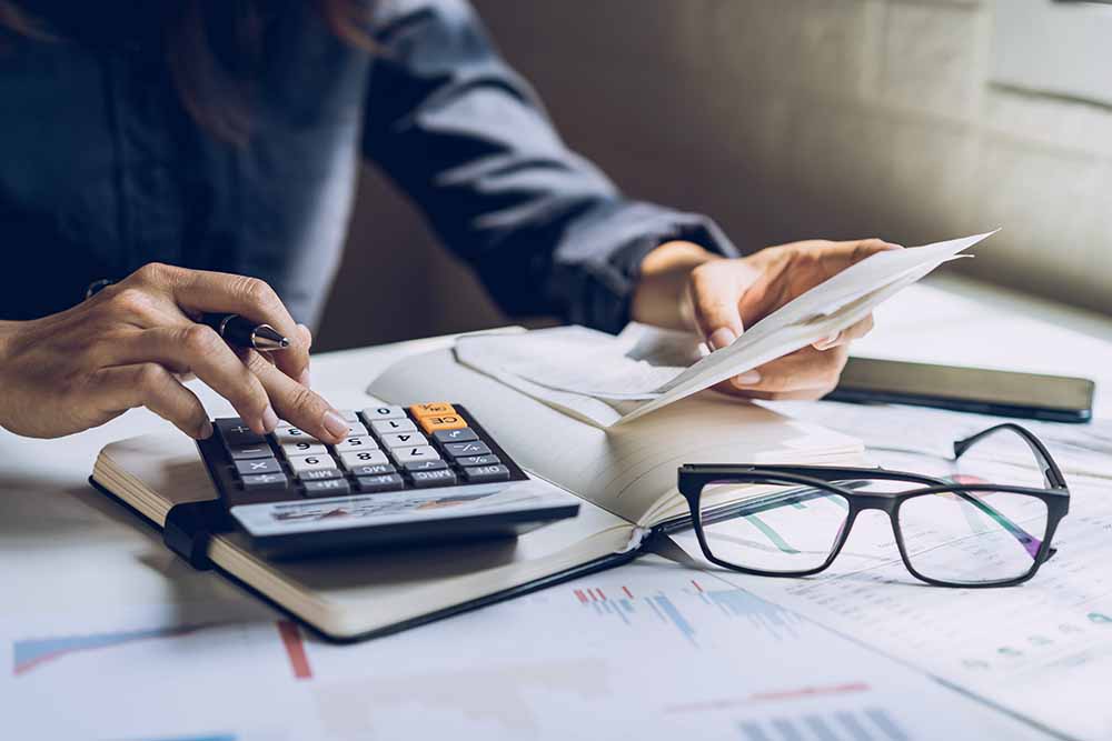 Woman calculating financial expenses