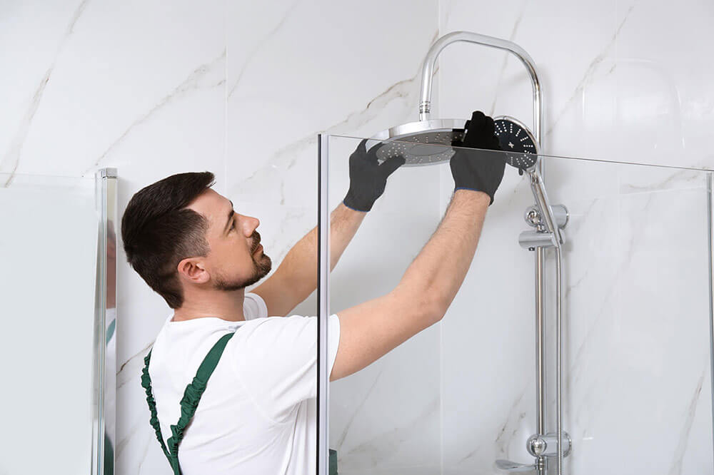 Man upgrading a showerhead