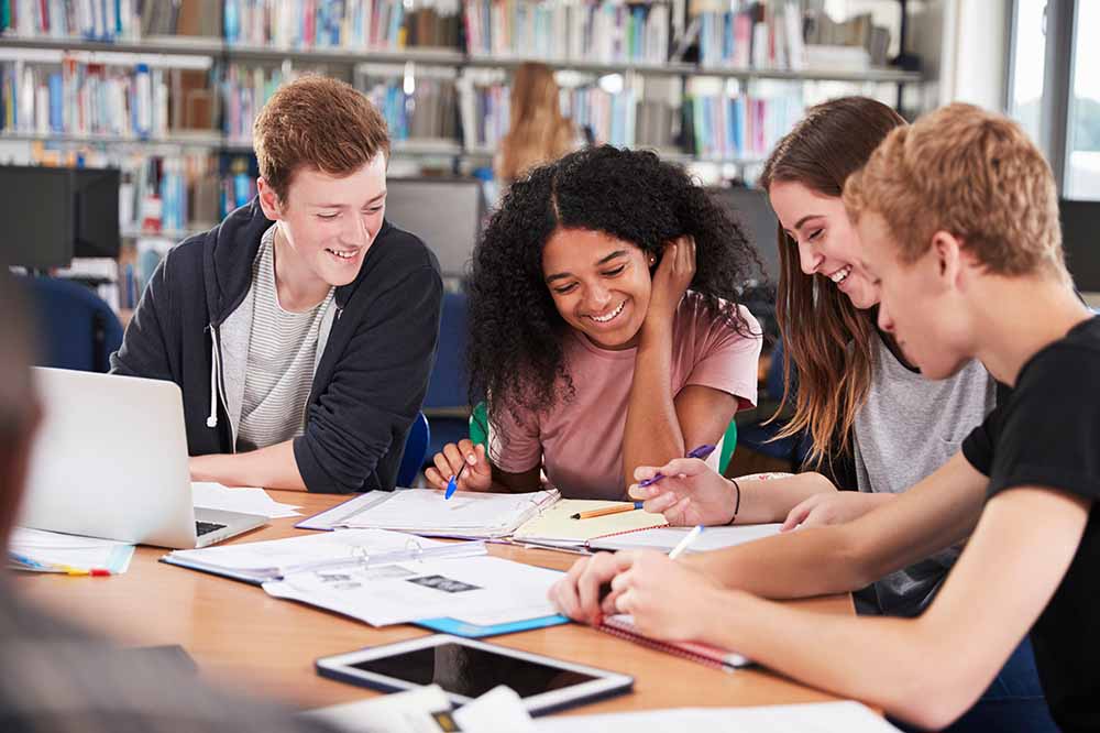 Group of students studying at a university library