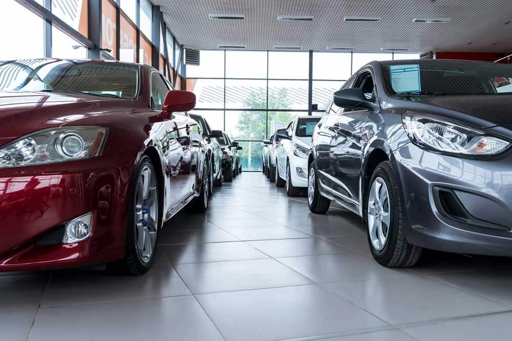 Cars for sale in a dealer show room