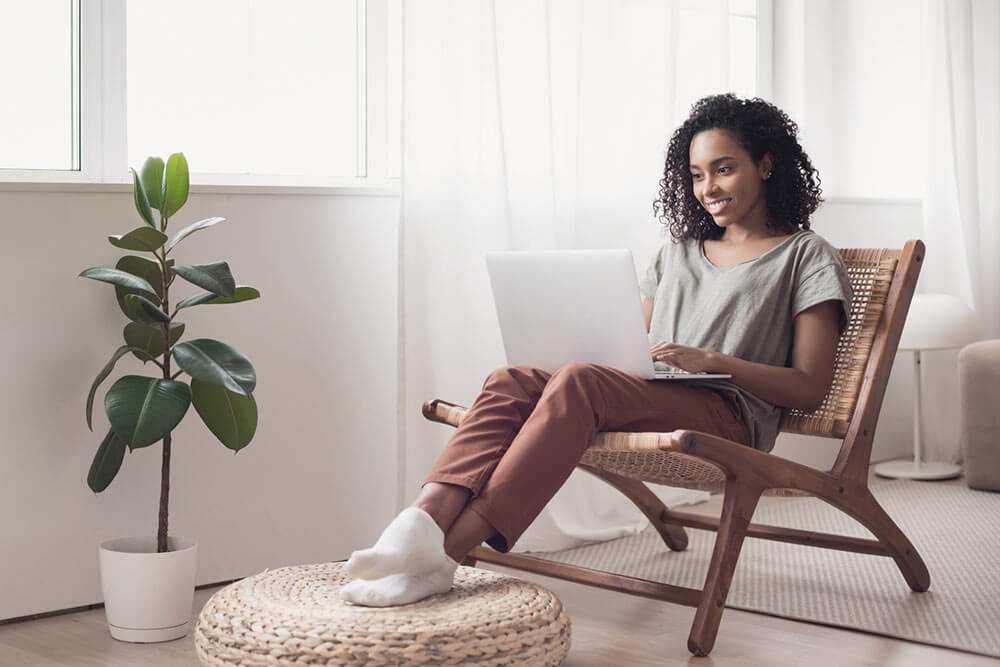 Woman on chair with laptop