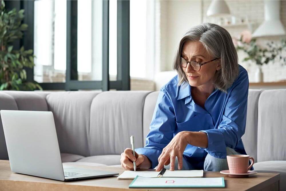 Woman at table switching car insurance