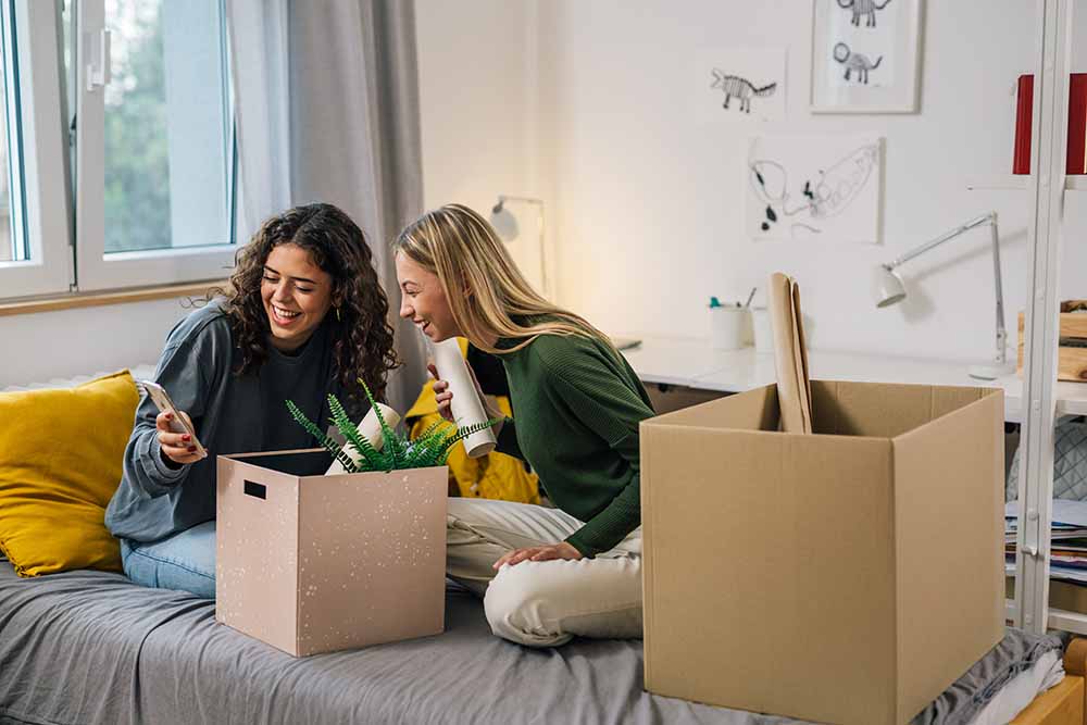 Young female students in a college dorm room