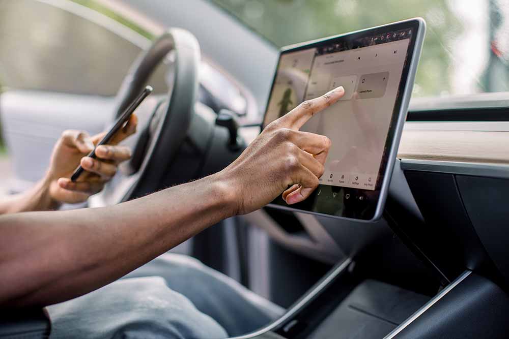 Person setting car features using a smartphone