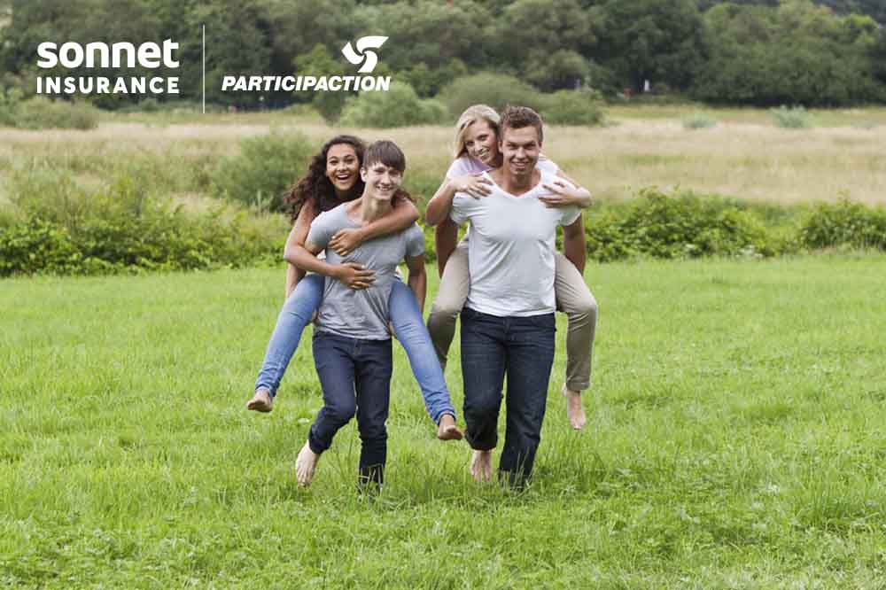 Two couples having a piggyback race