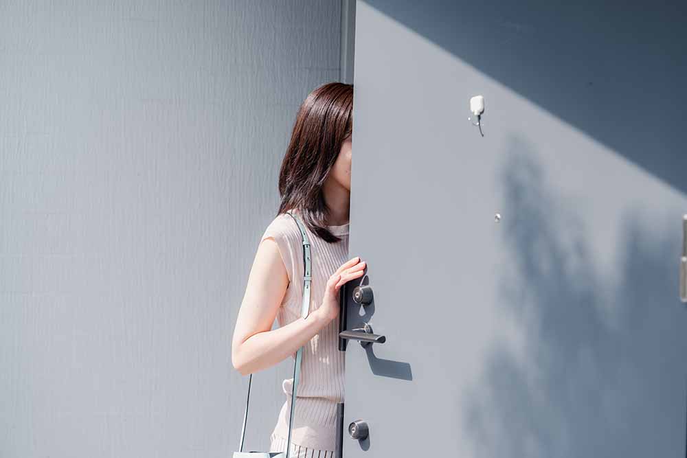 Young woman leaving a condo