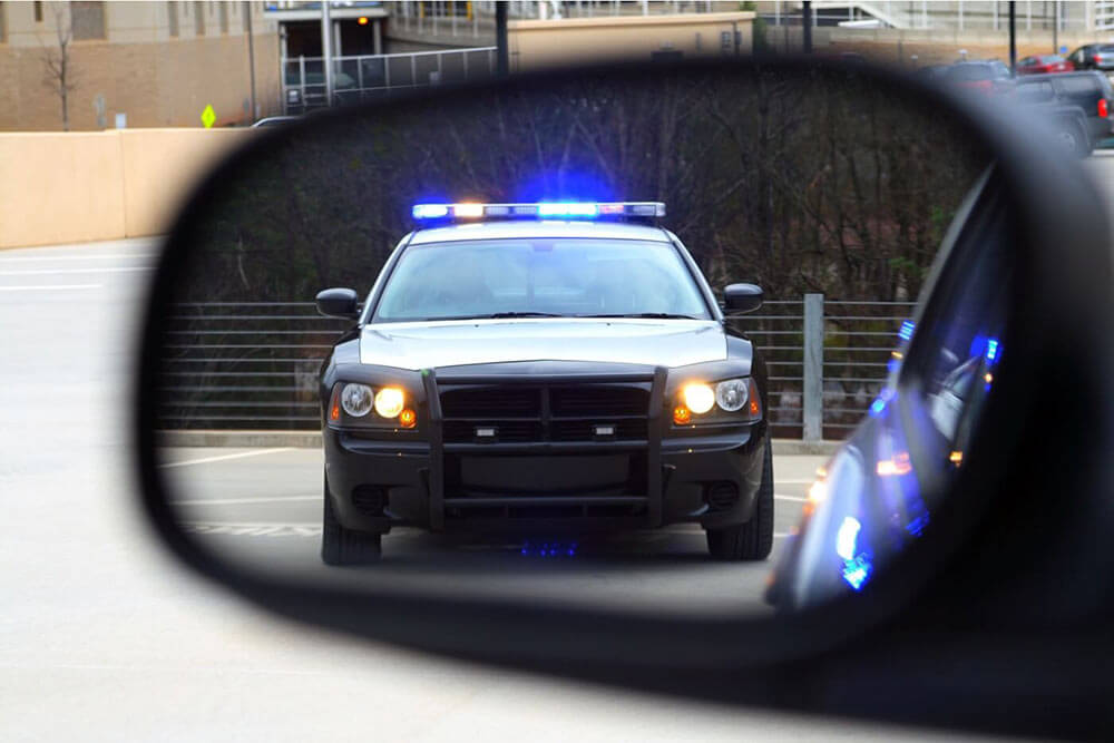 Police car coming for traffic ticket