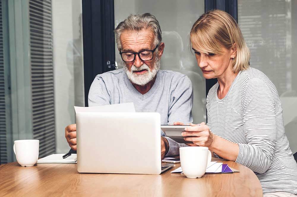 Older couple checking bills