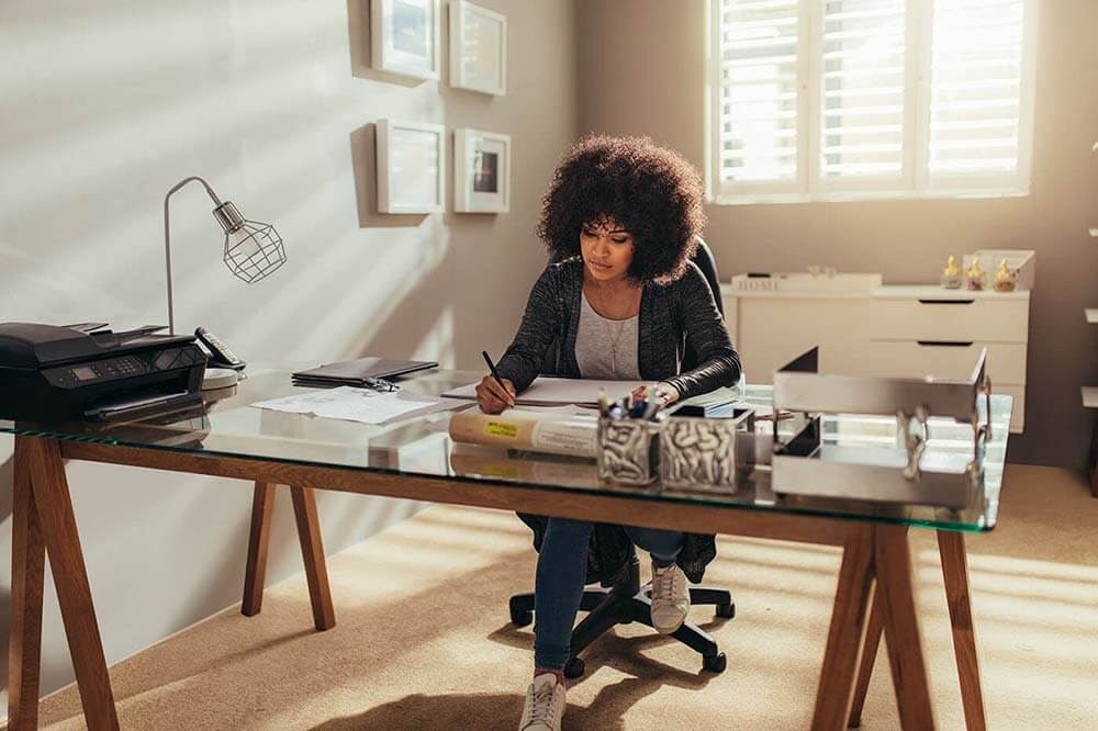 Young woman working from a home office