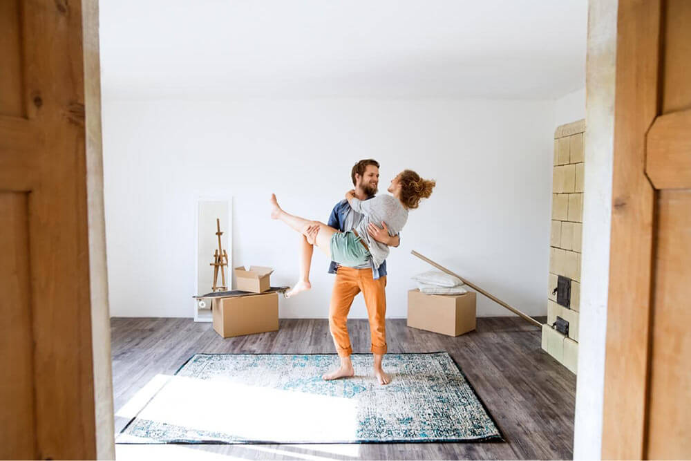 Happy couple moving houses