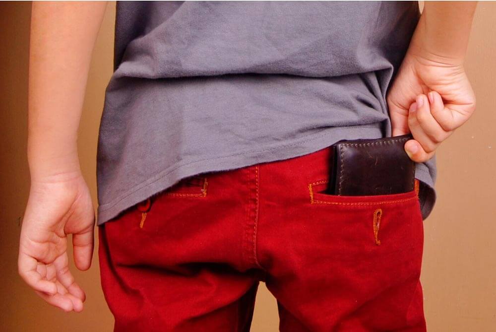 Putting wallet into pocket