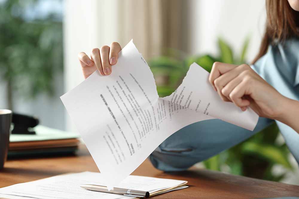 Person ripping a contract
