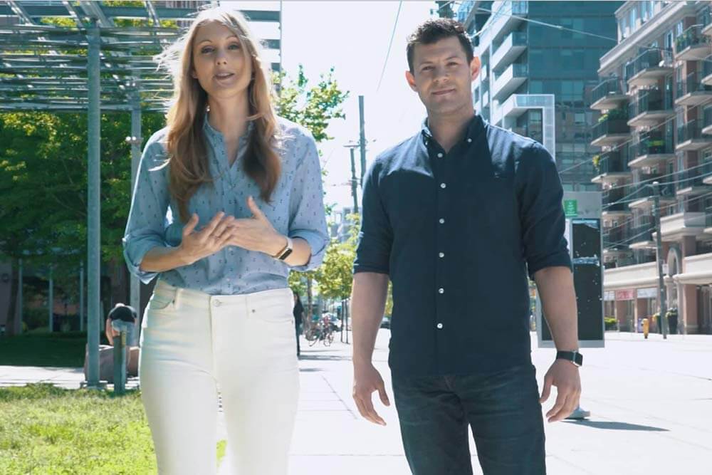 Erin Bury and Kevin Oulds walking down the street