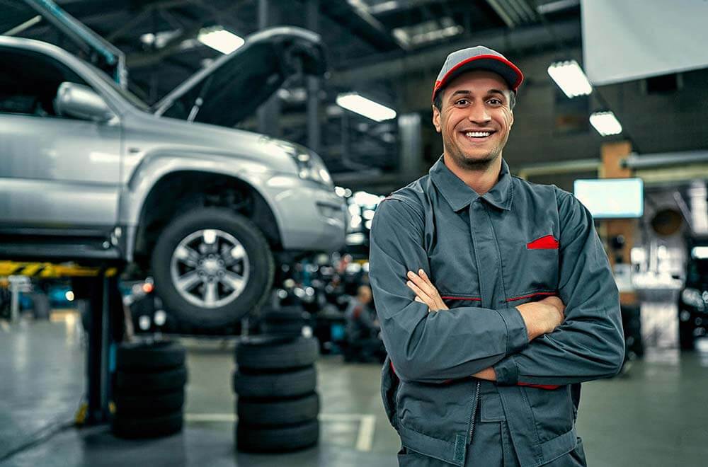 Friendly male mechanic smiling