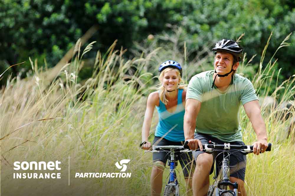 A couple biking outdoors