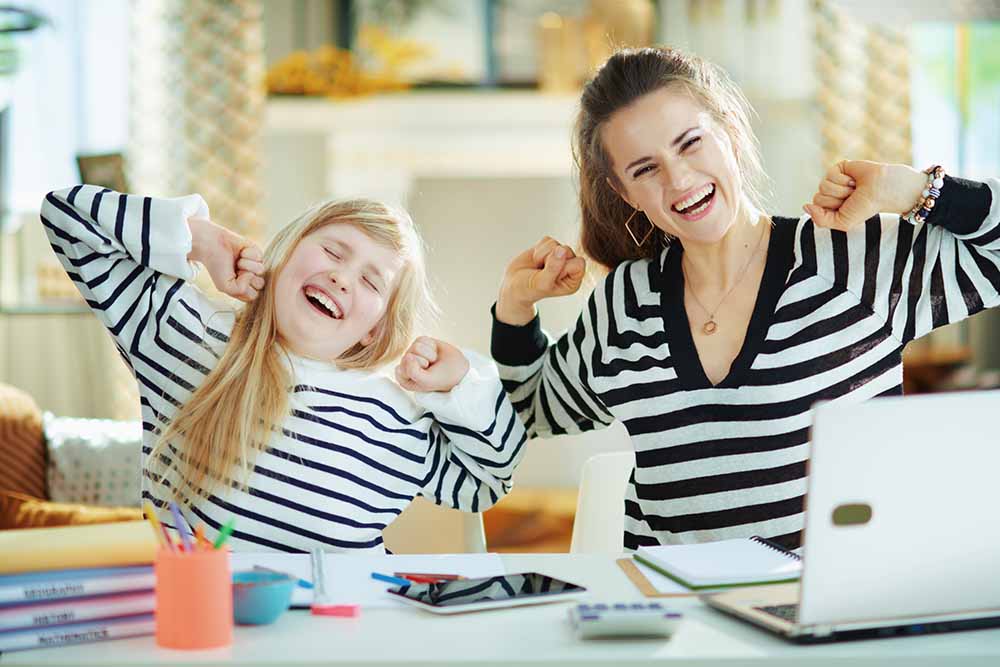 Mom and child at a computer