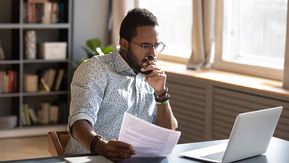 Man looking at a laptop