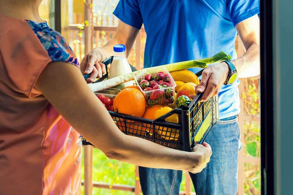 Woman receiving grocery delivery