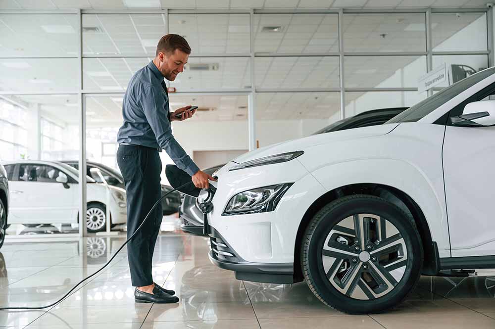 Man with cars in a dealership