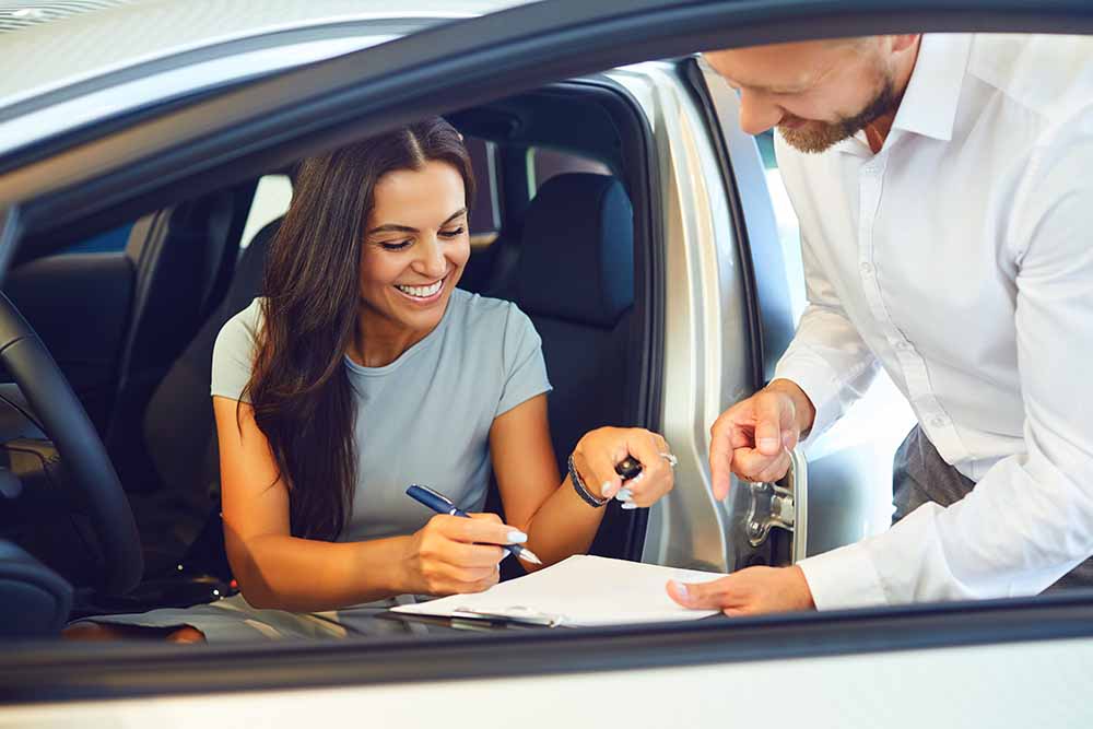 Woman renting a car