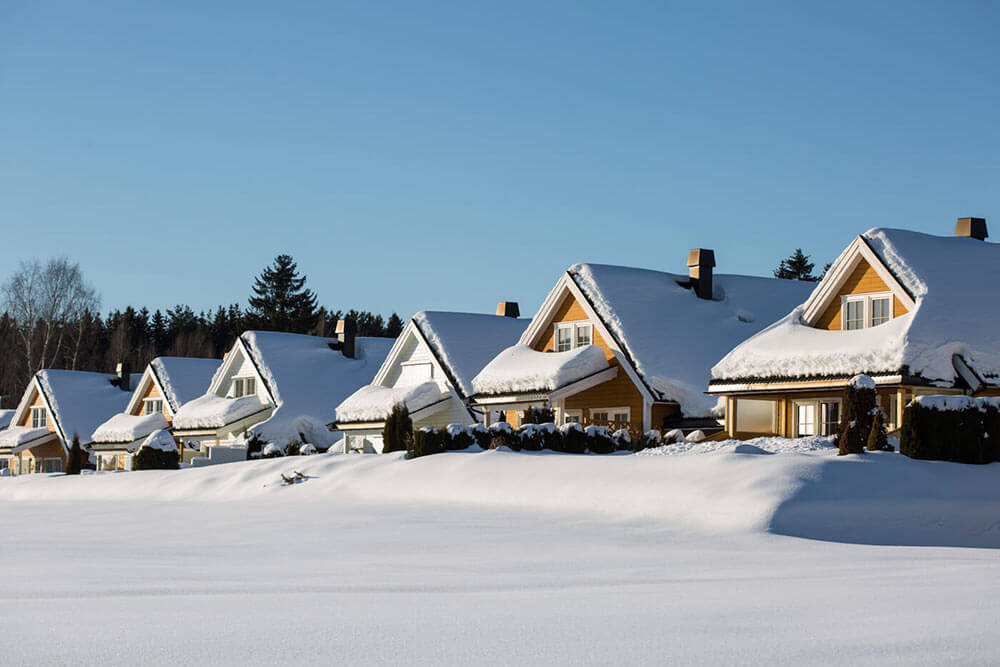 Row of snowy roofs