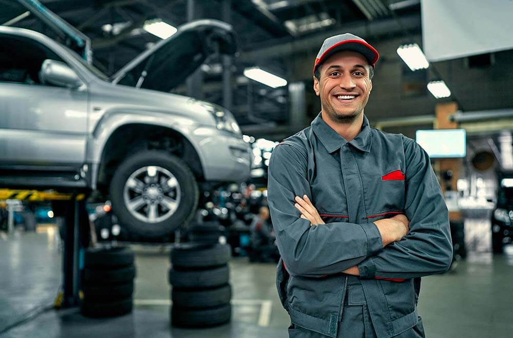 Friendly male mechanic smiling