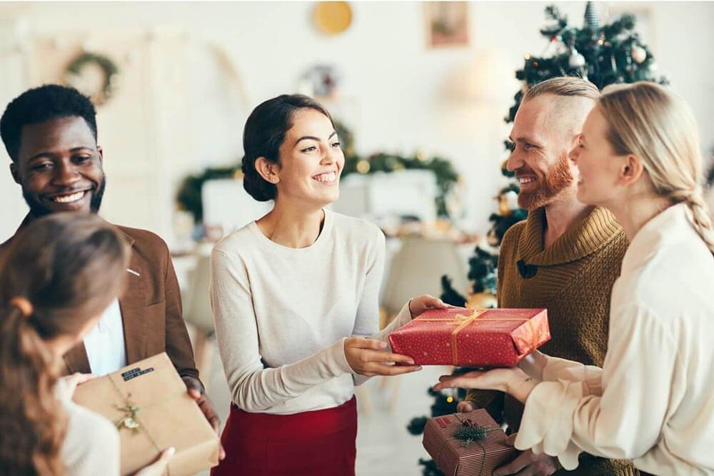 People exchanging gifts during the holidays