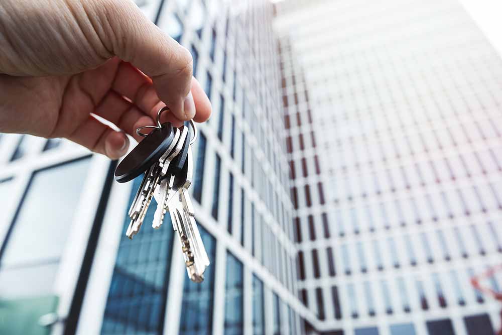 New condo buyer holding a set of keys