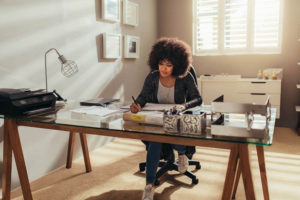 Woman doing taxes at home